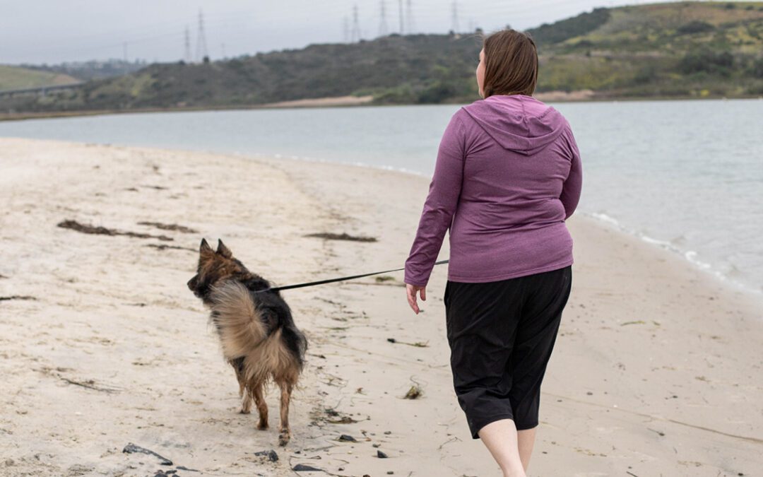 Woman walking her dog at the lagoon