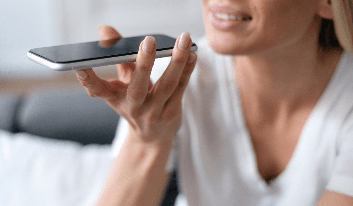 3 Woman talking into her phone as it transcribes notes